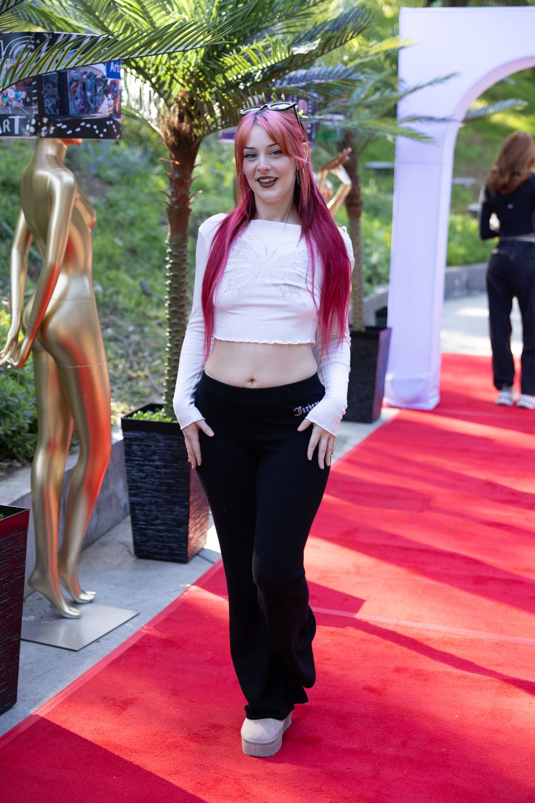 A SC House Hollywood cast member arrives on the red carpet outside the Hollywood Hills mansion