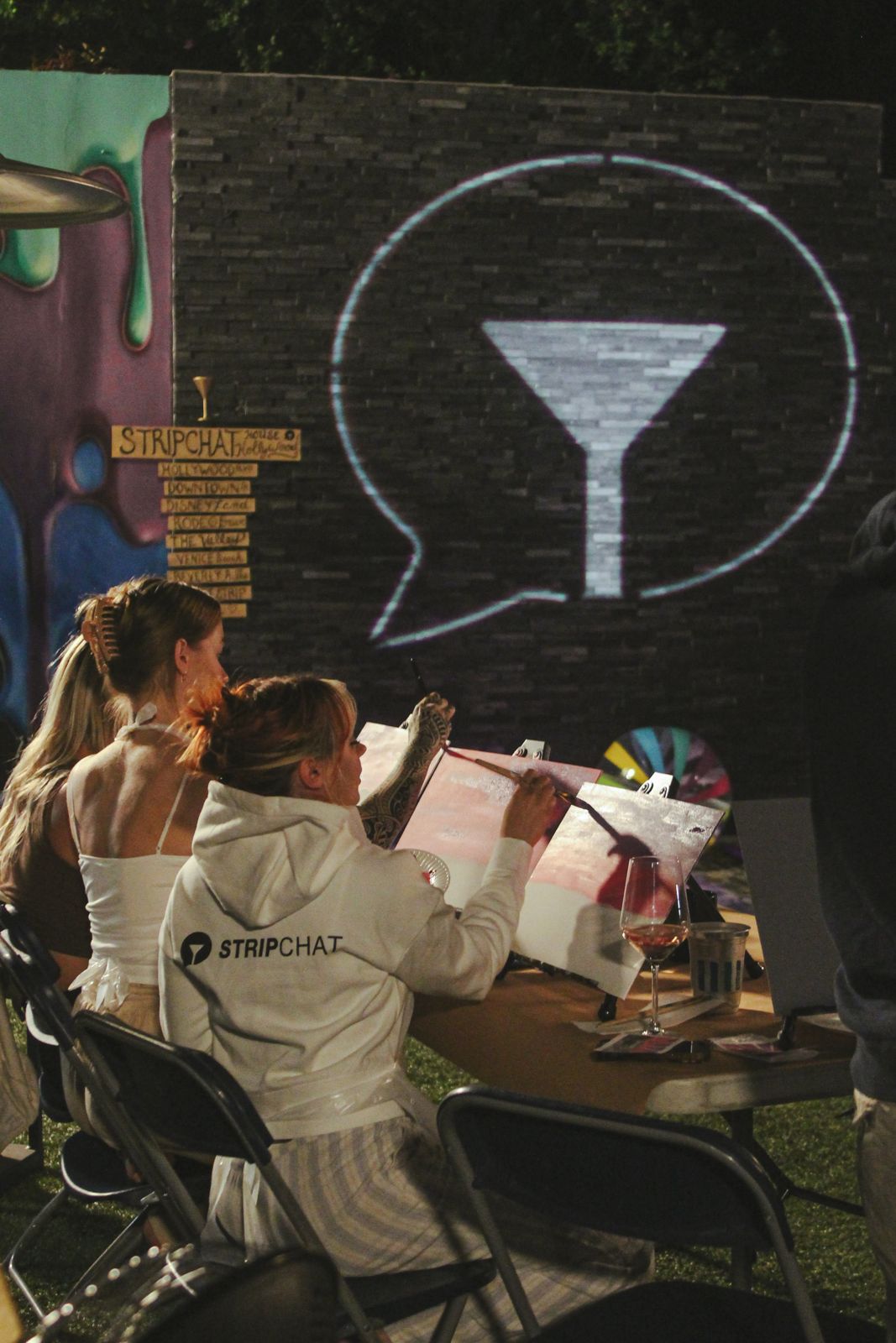 Cast members painting canvases at the evening sip and paint session at the SC House