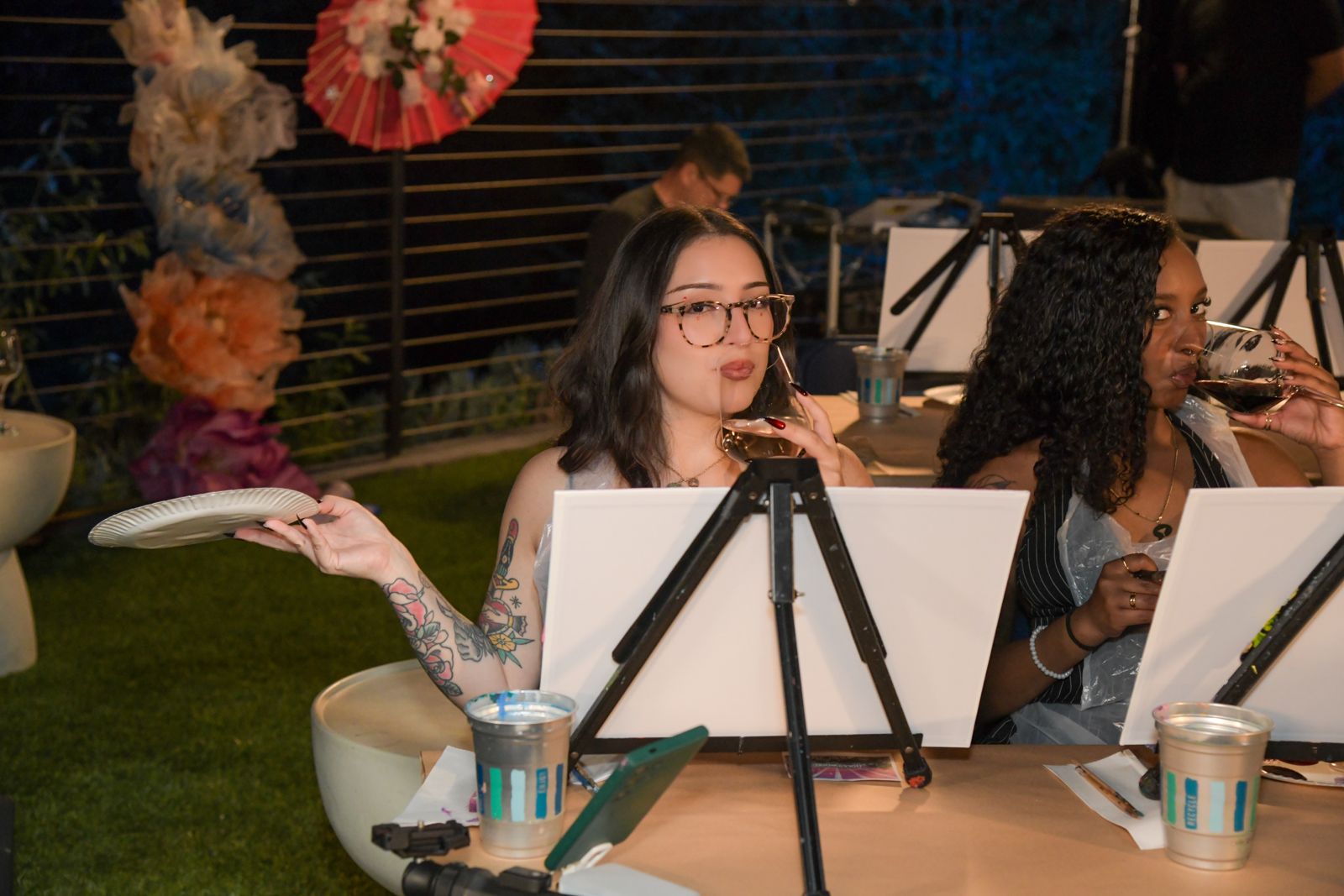 Cast members painting canvases at the evening sip and paint session at the SC House