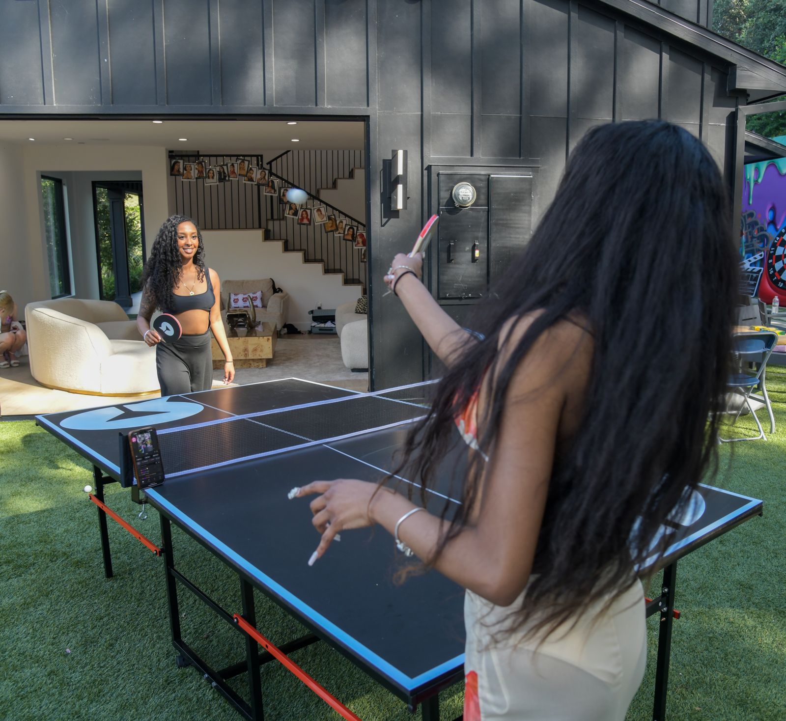 Cast members relaxing around the SC House Hollywood mansion between shoots