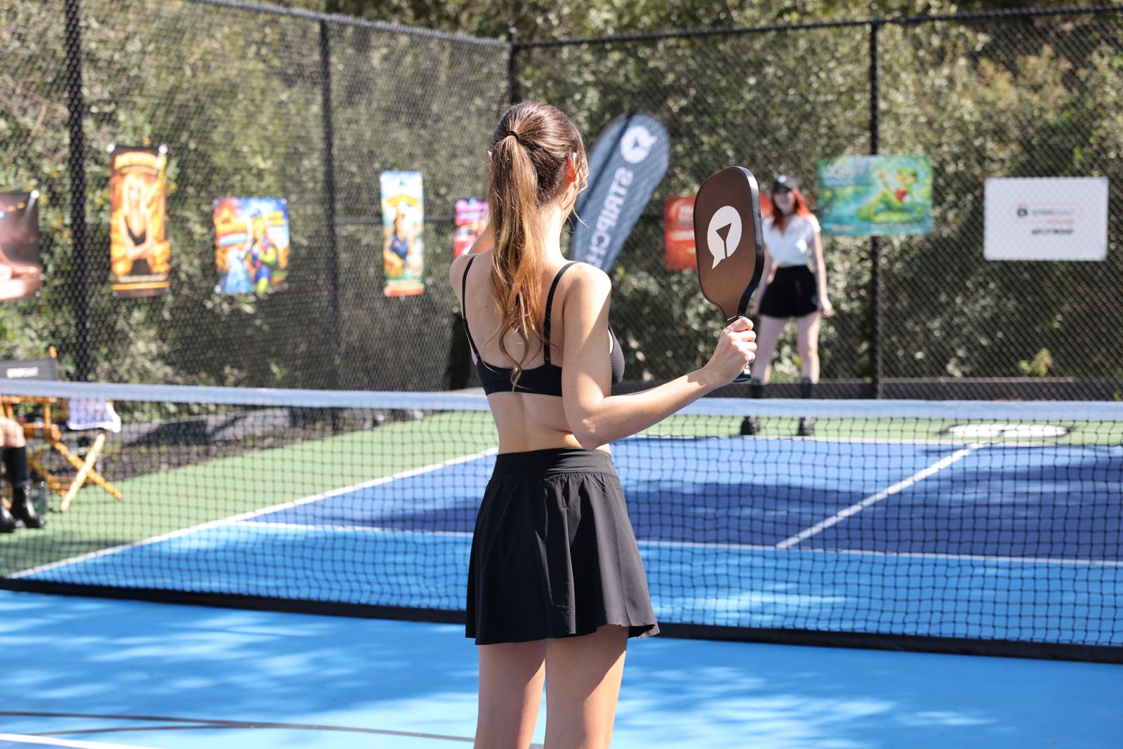 The SC House pickleball tournament in racquet-club uniforms on the private Hollywood Hills court