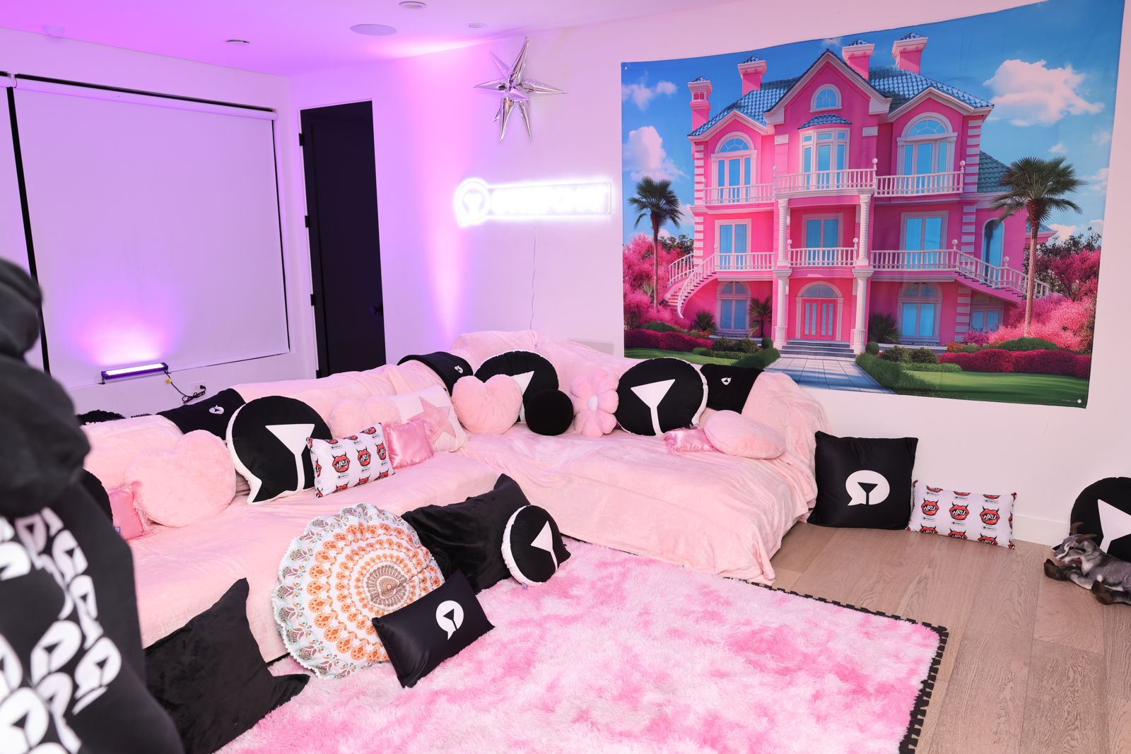 The empty Barbie-themed pink bedroom inside the SC House Hollywood mansion, dreamhouse backdrop and branded pillows ready