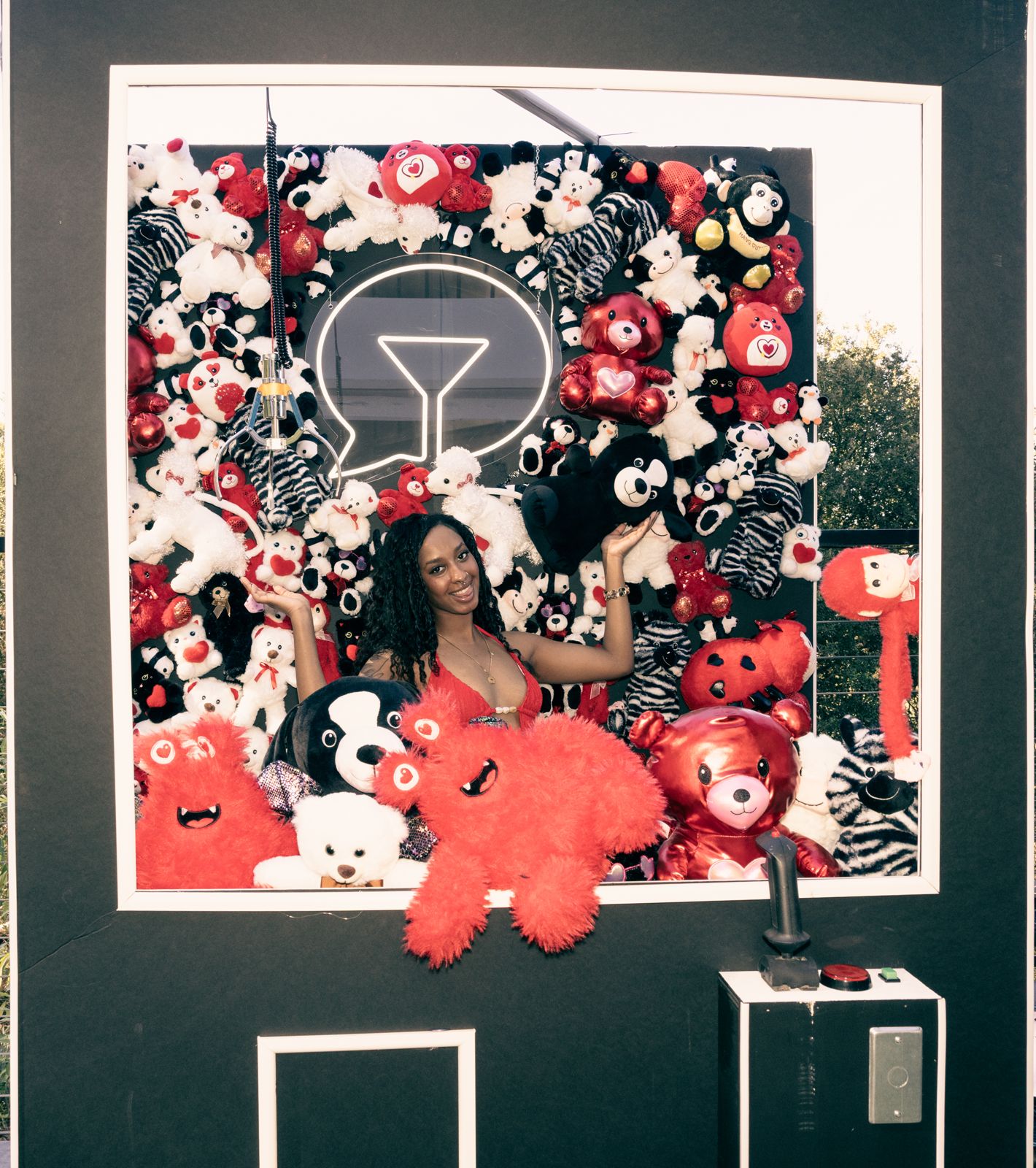 Posing at the teddy-bear claw-machine wall at the SC House Hollywood