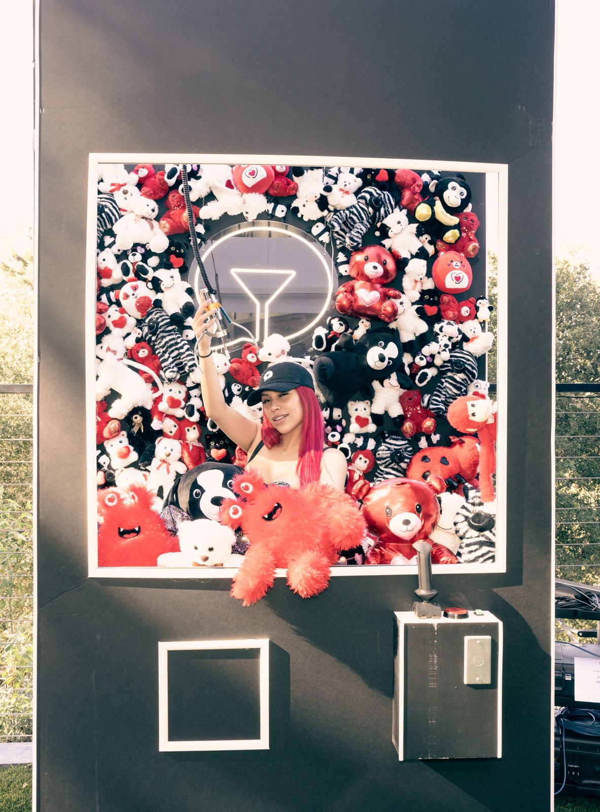 Posing at the teddy-bear claw-machine wall at the SC House Hollywood